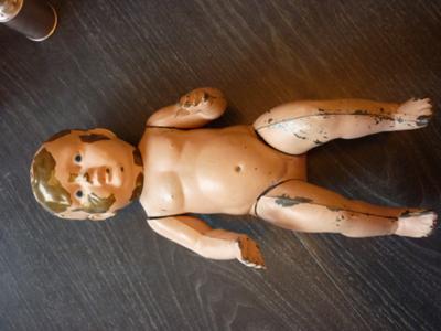 Arline's full bodied male tin doll