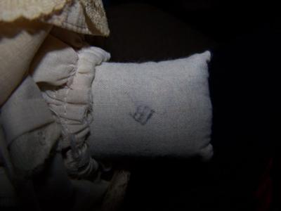 Marking on sack body of doll